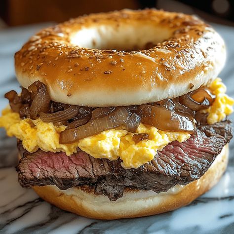 Copycat McDonald’s Steak Egg and Cheese Bagel Steak Egg And Cheese Bagel Sauce, Mcdonald's Steak Egg And Cheese Bagel, Healthy Bagel Sandwich, Steak Egg And Cheese Bagel, Cheese Bagel Recipe, Egg And Cheese Bagel, Types Of Bagels, Shaved Steak, Healthy Bagel