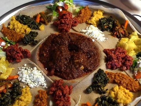 Doro Wat on Injera (Ethiopia) | 29 Heavenly Christmas Foods From Around The World Ethiopian Christmas, Doro Wot, Christmas Food Recipes, Doro Wat, Different Types Of Food, Ethiopian Cuisine, Pan Pita, Ethiopian Food, Cooking Channel