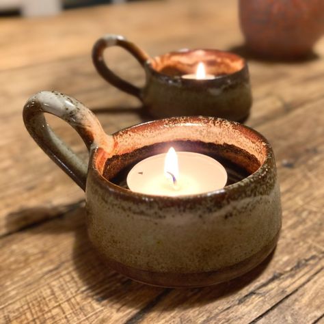 Ceramic tealight holder with handleperfect size to hold candle tealightsAs the nights draw in and the days get colders these candle holders are perfect for placing around your room and adding that romantic cosy feeling to your homeThey also make great table decorations and will add that atmospheric effect with entertaining at homeDesigned in the UK and made by artisans in Southern Indiaunder the fair trade schemeThey're only made in small batches and so stock is limited**PRE-ORDERS Clay Candle Pot, Tealight Candle Holders Ceramic, Ceramic Tealight Holder, Clay Tealight Holder, Ceramic Tea Light Holders, Cement Projects, Clay Candle Holders, Christmas Pottery, Boo Board