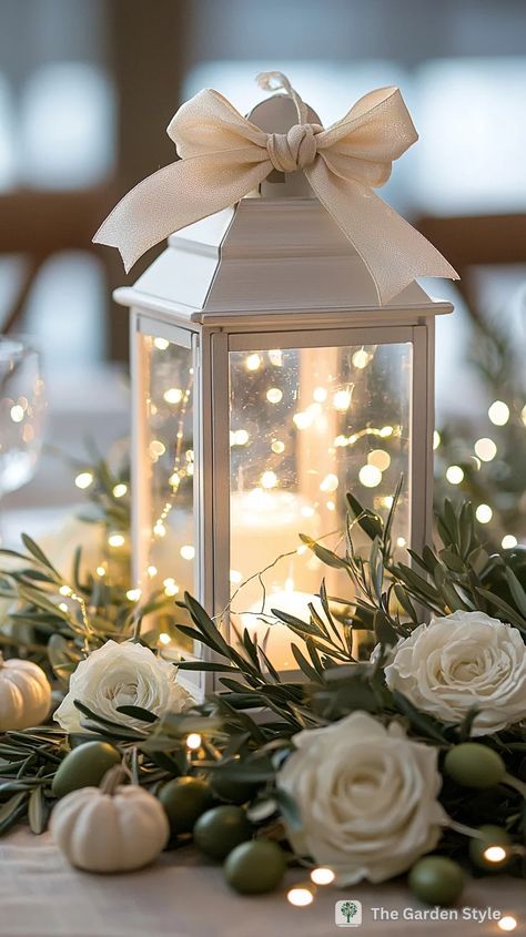 Open Lantern Centerpiece, Lantern Fairy Lights Centerpiece, Wedding Luminaries Diy, Lantern And Flower Centerpieces, Lanterns With Fairy Lights, Simple Thanksgiving Table Settings, White Lantern Centerpieces, Thanksgiving Lantern, Lantern Decor Ideas