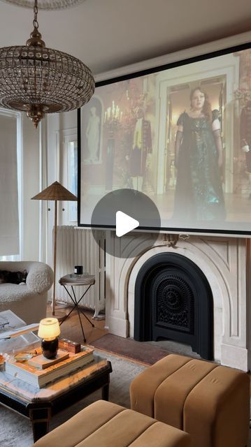 Mallory Fletchall | Reserve Home on Instagram: "On repeat 🫡 what do we think of season 3 so far? We installed an additional projector screen downstairs so we can move our portable projector around to watch wherever is most comfy in the moment. 10/10 recommend.⁣
⁣
⁣
⁣
⁣
#homedecor #interiordesign #diyhome #bridgerton #cozyvlog cozy home, cozy room, nyc apartment, parisian style, parisian vibes, living room design, home decor, living room decor, apartment decor, vintage home, day in the life, vlog" Projector Tv Living Room, Tv Projector Living Room, Living Room Projector Setup, Vibes Living Room, Projector Screen Living Room, Apartment Decor Vintage, Apartment Parisian, Projector Setup, Home Cozy