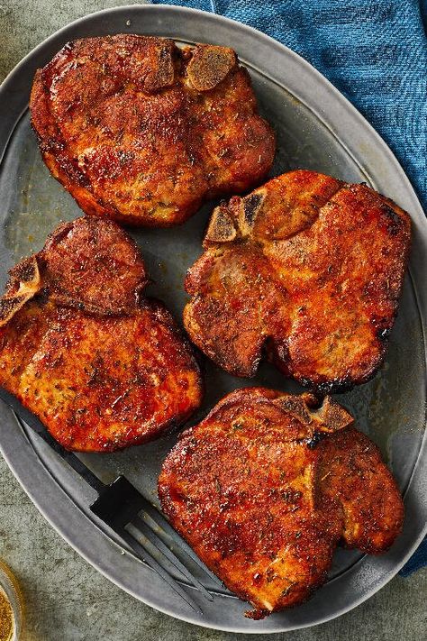 Smoked Pork Chops | "You don’t have to be an expert smoker to make tender, expertly seasoned smoked pork chops. Our recipe works for beginners and pros. The seasoning mixture and overnight sitting will make the best crust possible, which will make the smoking process go smoothly. Serve with red wine, roasted veggies, salad, and cold beer." #porkrecipes #porkdishes #pork #porkchops #porkchoprecipes #dinner #dinnerrecipes Pellet Smoker Recipes, Smoked Pork Chops, Pellet Grill Recipes, Traeger Recipes, Smoked Meat Recipes, Smoked Cooking, Chops Recipe, Smoked Pork, Smoker Recipes