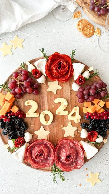 Kristel Talie on Instagram: "New Year’s Day is calling☎️ save this charcuterie sharing board for NYE🥂 Shopping list Salami slices Chorizo slices Camembert Cheddar cheese Mozzarella mini balls Red grapes Blackberries Red currants Emmental cheese Rosemary sprigs Star sprinkles Enjoy!✨ #nye #charcuterieboard #cheeseboard #appetizers #holidayrecipes" Emmental Cheese, Red Currants, Cheese Mozzarella, Star Sprinkles, Rosemary Sprigs, Red Grapes, Christmas Snacks, Sharing Board, Finger Food