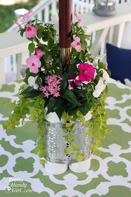 PVC pipe isn’t normally seen as a beautiful centerpiece.  But with some clever ingenuity, it turns your deck table umbrella pole from an eye sore, to an “I like!” Patio Table Centerpiece, Outdoor Table Centerpieces, Serving Station, Patio Table Decor, Plant Centerpieces, Patio Table Umbrella, Deck Table, Diy Outdoor Table, Outdoor Patio Table