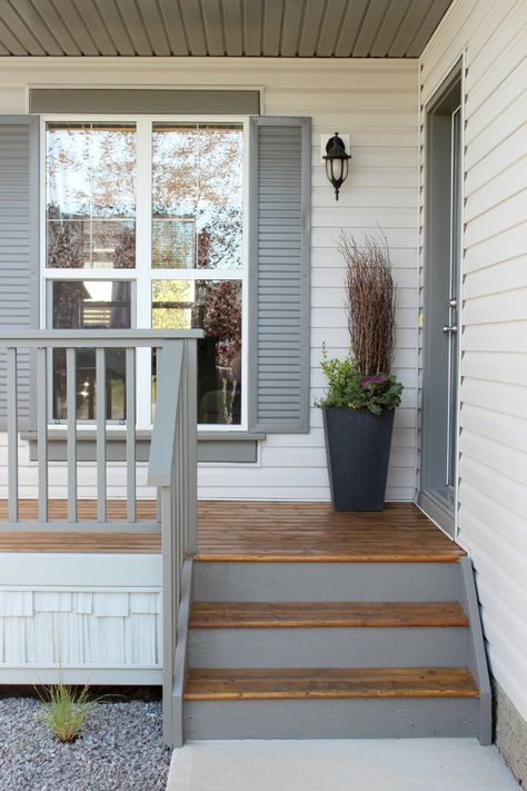 Paint porch a grey slightly lighter than the charcoal planned for front door. Add (DIY) decorative shutters in same color. Gray Front Door Colors, Grey Front Door, Decorative Shutters, Wrought Iron Front Door, Rustic Shutters, Front Porch Makeover, Iron Front Door, Porch Paint, Front Door Makeover