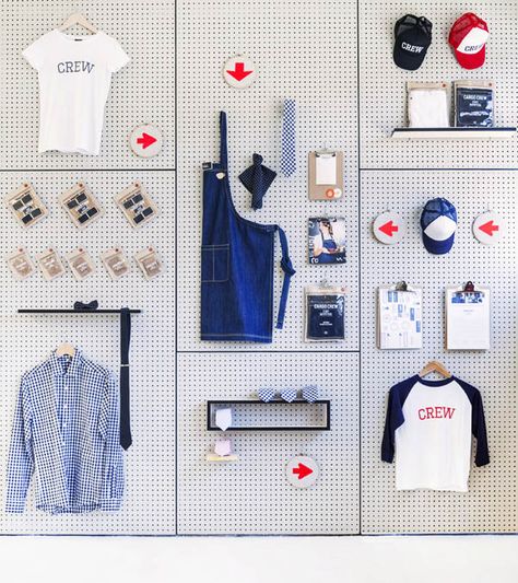 CargoCrew1 Pegboard Merchandise Display, Magnet Display Ideas Retail, Video Studio Design Ideas, Retail Merchandising Displays, Product Display Wall, Large Pegboard, Merchandise Display, Pegboard Wall, T-shirt Display