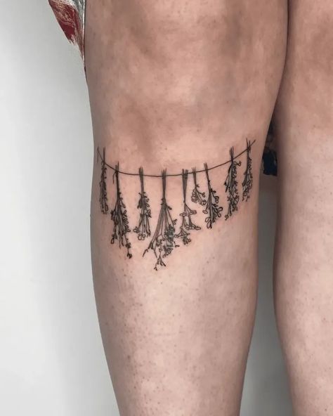 Ready to elevate your tattoo game? Explore these 60 stunning aesthetic tattoo ideas that will grab everyone's attention. From delicate designs to bold statements, find inspiration for your next ink masterpiece. #tattooideas #inkinspiration #tattooart Hanging Herbs Tattoo, Elegant Matching Tattoos, Herb Tattoo Ideas, Thigh Tattoos Women Above Knee, Thigh Tattoos Women Aesthetic, Key Tattoo Designs For Women, Thigh Tattoos Unique, Tattoo Ideas To Draw, Matching Thigh Tattoos