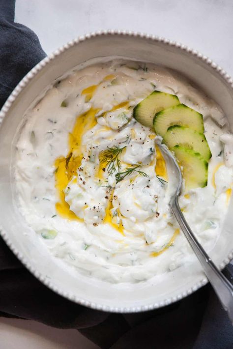 For a light, tangy, and refreshing dip that's full of flavor and protein, try this Healthy Tzatziki Sauce Recipe. It's a wonderful seven-ingredient dish that's ready in less than 15 minutes. Healthy Tzatziki Sauce, Healthy Tzatziki, Low Calorie Sauces, Erin Lives Whole, Best Dip Recipes, Tzatziki Sauce Recipe, Homemade Tzatziki Sauce, Tzatziki Recipes, Homemade Tzatziki