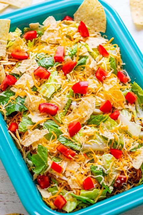 Layered Beef Taco Salad – A classic taco salad that everyone LOVES, it’s EASY, and it’s ready in 20 minutes!! There’s ground beef, refried beans, red peppers, tortilla chips, cheese, lettuce, and tomatoes!! Layer Taco Salad, Salad With Ground Beef, Layered Taco Salad, Beef Taco Salad, Layered Taco Salads, Tomatoes Salad, Layered Taco, Recipe With Ground Beef, Taco Salad Recipe