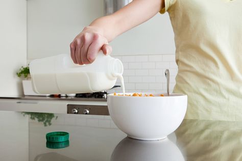 A woman is pouring milk onto cereal in this file photo. (Credit: Getty Images) Frugal Habits, Cold Cereal, Old Commercials, Bowl Of Cereal, Pink Milk, Fruity Pebbles, Food Test, Skim Milk, Quick And Easy Breakfast