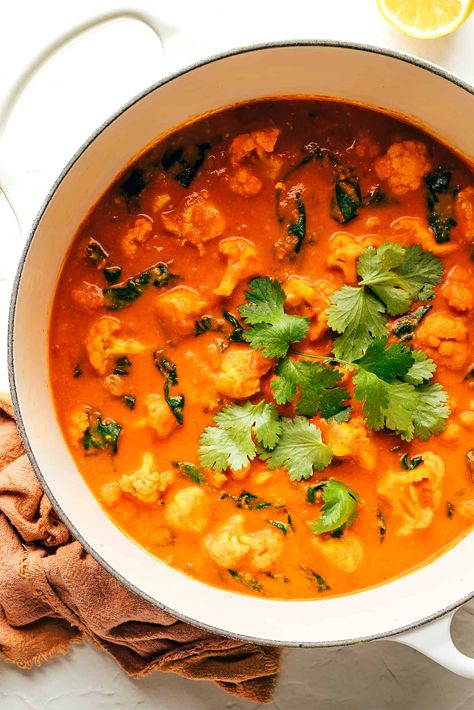 This Indian-inspired butter chicken and cauliflower recipe is easy to make, naturally gluten-free, and simmered with the most delicious curry sauce. Serve with rice or naan and enjoy! | gimmesomeoven.com Chicken And Cauliflower, Chicken Cauliflower, Cauliflower Recipe, Gimme Some Oven, Cauliflower Curry, Butter Chicken Recipe, Dutch Oven Recipes, Sauteed Veggies, Curry Sauce