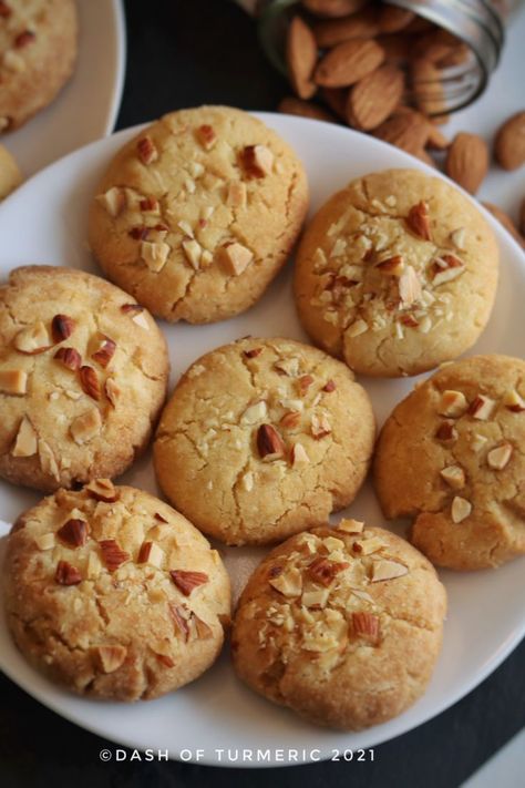 These Eggless Almond Cookies are rich, buttery, crisp from the outside, and soft and melt in your mouth from inside. Kids or adults, everyone loves to munch on these cookies. It is simple, quick and easy to make, melt in mouth cookies. It is made from almond flour or almond meal, all-purpose flour (maida), sugar and ghee. #dashofturmeric #almond_cookies#almond #cookies #winter Almond Tart Recipe, Almond Flour Recipes Cookies, Cookies Eggless, Almond Flour Biscuits, Chinese Almond Cookies, Eggless Cookie Recipes, Eggless Cookies, Cheesecake Bites Recipe, Almond Meal Cookies