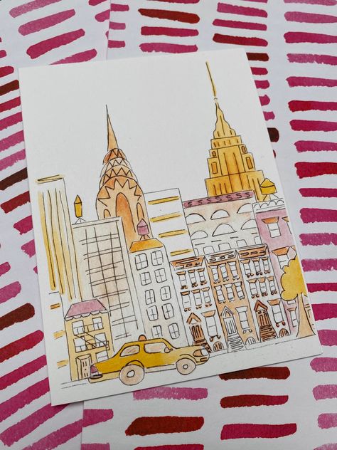 "New York Street, Blank Greeting Card  This NYC street scene has everything you love about New York, Brownstones, a yellow Taxi, the Empire State, the Chrysler Building, Fire Escapes and Water Towers! It is printed from an original hand painted watercolor. So you're getting an unique handmade original design. It is printed on A6 bright white card and comes with a white envelope (4.5\" x 6.25\"). It is blank inside for your own message. You can see other New York greeting cards I've designed here Things To Draw Watercolor, Nyc Watercolor Painting, New York Painting Easy, New York Buildings Drawing, Nyc Skyline Drawing, New York City Watercolor, Unique Watercolor Paintings, Empire State Building Art, New York Card