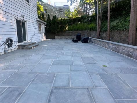 We love the look of this new patio featuring a stone wall built with Liberty Hill Mosaic. This patio space by @elandscapingllc highlights the combination of blue stone and the Liberty Hill Collection, both popular natural stone options with blue/grey colors. Excellent masonry work resulting in an outdoor living space ready for entertainment. Thank you to @sawmillstone for supplying the materials! #delgadostone #stonework #masonry #leadbyexample #outdoorliving #usenaturalstone #patiodesign Belgian Block, Masonry Work, Lead By Example, Patio Spaces, Stone Work, Stone Wall, Patio Design, Blue Stone, Outdoor Living Space