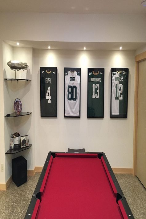 Shadow Box Jersey Display, Jersey Frame Ideas Display Case, How To Display Jerseys On Wall, Football Jersey Frame Ideas, Diy Jersey Display Case, Jersey Hanging Ideas, Framed Football Jersey, Football Memorabilia Display, Hanging Jerseys On Wall Ideas