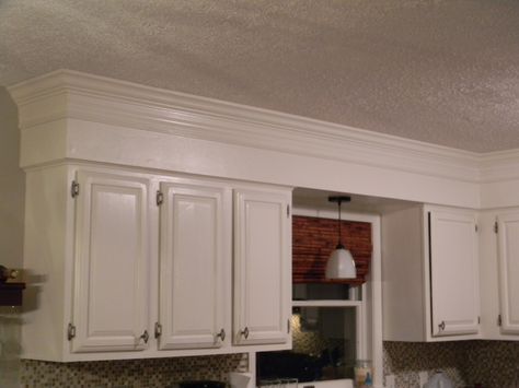 Have 80's bulkheads in your kitchen? Not anymore! Make your old cabinets look like custom-to-the-ceiling cabinetry by adding some crown molding and painting the bulkhead and old cabinets to match. Cabinet Bulkhead, Cabinet Soffit, Crown Moulding Kitchen Cabinets, Molding Kitchen, Soffit Ideas, Crown Molding Kitchen, Kitchen Cabinet Crown Molding, Kitchen Cabinets To Ceiling, Kitchen Soffit