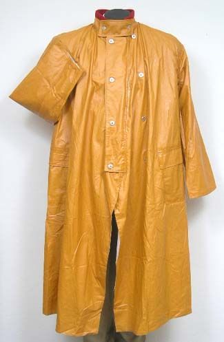 Pommel Rain Slicker Authentically reproduced to replicate the old time “Fish Brand” slickers.  The slicker is very light weight and has a water resistant finish using modern day materials.  It has a cotton muslin lining and a traditional red wool collar with storm closure.  #PommelRainSlicker #Fisherman #CowboyGear Candy Mountain, Rain Slicker, 1950s Mens, Cowboy Gear, Wind And Rain, Cotton Muslin, Red Wool, Muslin Cotton, Metal Buttons