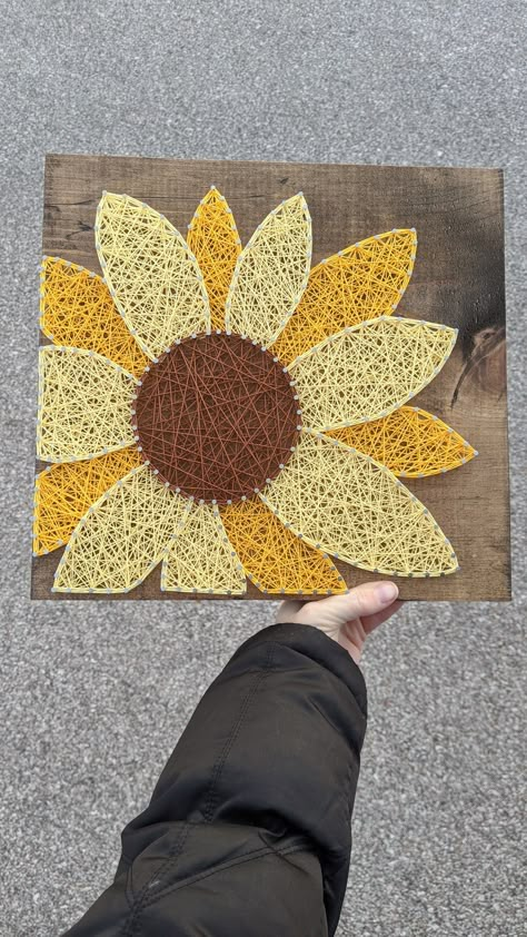 "Add some sunflower brightness to your room with this unique string art sign. Standard sign details as seen in the first photo. -Size: 11.5 square -Wood finish: Dark Walnut Stain -String color as pictured. Made to order signs can be customized, add a note in the personalization section to make the sign unique to you. This is a made to order sign - I work hard to create your orders and get them shipped as quickly as possible, but please allow standard of 1-2 weeks for your item to be handcrafted Large String Art, Hands On Art Projects, Nail Yarn Art, String Art Szablon, Nail String Art Template, Sunflowers Decorations, Diy Sunflower Decor, Wood Nail Art, Sunflower String Art