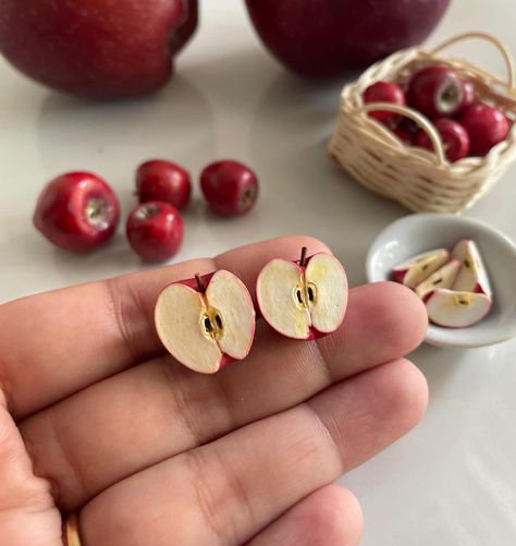 These Apple Studs are perfect for those who loves Apple ! This is a 100% hand-made realistic fake food miniature. Now you can have your favourite fruits as a Miniature earrings. "Hello Miniverse" creates uniquely handmade fruits inspired Fruits Earrings that look as delicious as the real thing.  I make sure packaging is high quality to sustain rough handling by courier service during transit. Dispatch time: Within 15 days.  Delivery time:  Domestic: 5-6 Days International: 20-25 days. Care: Please treat the Apple Studs with care. Remove dust with a piece of soft fabric, a brush or a sponge. Protect the product from damages. Do not drop. If you have any question about this listing or anything else, please feel free to contact me. I will get to you as soon as i can! Thanks for viewing this l Fruit Accessories, Miniature Earrings, Polymer Clay Accessories, Apple Bag, Clay Fruit, Apple Earrings, Clay Making, Miniature Food Jewelry, Quirky Jewelry