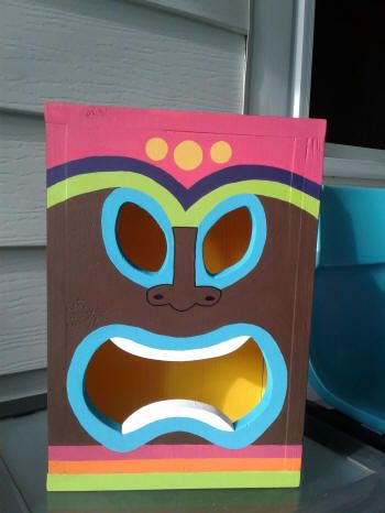 DIY tiki mask light | Crazy DIY Mom Diy Tiki Mask, Tiki Lights, Tiki Faces, Mask Light, Diy Beach Decor, Tiki Statues, Tiki Decor, Diy Beach, Tiki Mask