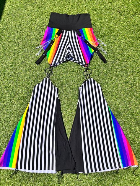 MTO= Made To Order  All pants come with side chains and spikes!  FIRE 🔥 SAFE MATERIAL B/W strip fabric and rainbow fabric is made from 95% cotton and 5% stretch polyester Black fabric is a bamboo organic cotton blend with 5% stretch polyester  This is what all fire preforms use!  The original Boofy the clown bell bottoms! This design was drawn by talented clown bestie then brought to life by yours truly!  These bells detach making them extra sassy and when the future comes you'll be able to swa Rainbow Harem Pants, Black And Rainbow Outfit, Absurdist Fashion, Ravecore Outfits, Rainbow Clothes Aesthetic, Glitch Outfit, Rainbow Outfit Ideas, Oc Clothing Ideas, Clowncore Accessories