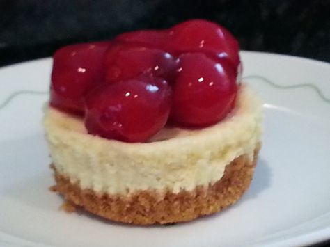 These are festive little cakes After cooled garnish with a sprinkle of cake sprinkles or get creative and use fresh berries; fresh sliced fruits; toasted coconut..... Prep time unknown; baking time 20 minutes THE BORDENS EAGLE BRAND CONDENSED MILK PROVIDES THE SWEETNESS TO THE CHEESECAKE MIXTURE...SUGAR IS NOT NEEDED. (except for stated amount in crust.) Miniature Cheesecakes, Mini Cherry Cheesecakes, Cherry Cheesecake Recipe, Mini Cheesecake Bites, Cheesecake Desserts Recipes, Mini Cheesecake Recipes, Make Ahead Desserts, Cheese Tarts, Cheesecake Cupcakes