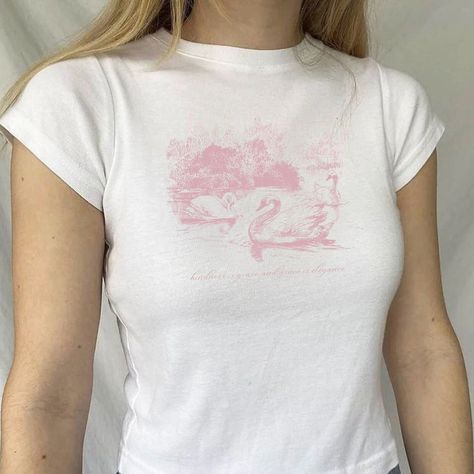 "🌟 Thank you for stopping by GirlyThreadsCo! This swan baby tee is made to order just for you! This is the perfect tee for ballet dancers, coquette lovers, trendy girlycore fans, or is great for everyday wear! 👕 PRODUCT & DESCRIPTION 🛑 PLEASE NOTE: The sizing of this baby tee is not the same as standard US Women's sizes. We recommend you size up 1-2 sizes to achieve the same fitted look as our model photo. This shirt does run small around the arms, shoulder, and bust area and we recommend sizing up. Our Gildan 5000B t-shirts are pure comfort and 100% cotton. Please be sure to check the sizing chart to choose the right size for your preferred fit. Lay your favorite baby tee at home flat and measure armpit to armpit to compare to the size chart in the photos. Also keep in mind that these Coquette Shirts, Clothing Coquette, Coquette Clothes, Coquette Clothing, Dollette Coquette, Coquette Top, Coquette Shirt, Aesthetic Coquette, Baby T Shirts