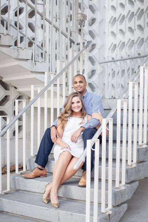 Staircase engagement pictures sitting down on the stairs. Pictures On Stairs Poses Couple, Couple Pose Stairs, Couple Pose On Stairs, Sitting On The Stairs Pose, Staircase Prom Pictures, Stairs Couple Photoshoot, Engagement Photos On Stairs, Stair Picture Poses, Photoshoot On Stairs