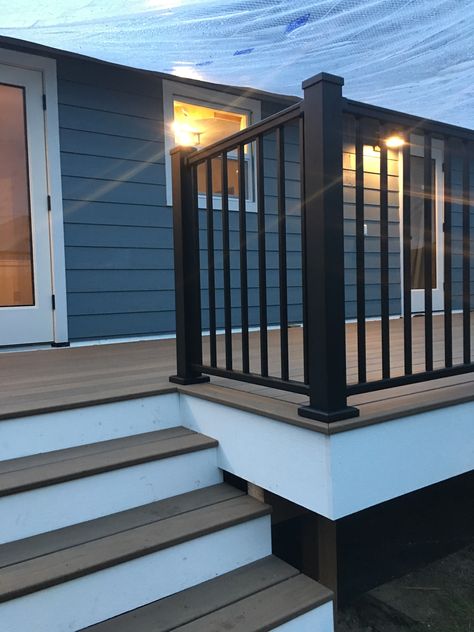 Our deck is coming along! #timbertech #pecan #boothbayblue Deck With Blue House, Dark Blue House With Deck, Deck Colors For Dark Blue House, Blue House With Deck, Outdoor Deck Color Ideas, Deck Colors For Blue House, Timbertech Deck Ideas, Grey Siding House, Navy Blue House Exterior