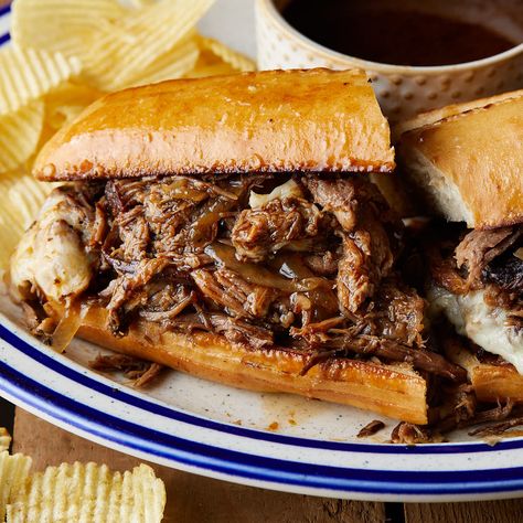 Slow Cooker French Dip Sandwiches feature tender beef cooked in a savory blend of beef broth, red wine, worcestershire, and herbs. Served on toasted rolls with melted cheese, these sandwiches are to die for. The slow cooking process ensures the beef is falling apart and creates a rich au jus sauce as the roast cooks. Au Jus Sauce, Slow Cooker French Dip Sandwiches, Jus Sauce, French Dip Sandwich Crockpot, Roasted Yukon Gold Potatoes, Roast Beef Crock Pot Recipes, Slow Cooker French Dip, Hamburger Helper Recipes, French Dip Sandwiches