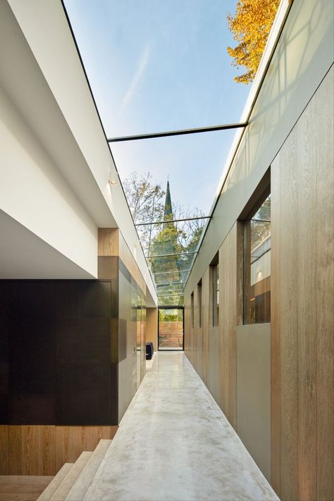 A glass strip rooflight brightens the long narrow corridor of a luxury London extension. London Extension, Glass Corridor, Glass Hallway, Narrow Corridor, Regents Park, Luxury London, Glass Roof, Community Center, Roof Light