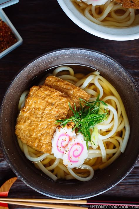 Kitsune Udon きつねうどん - Kitsune Udon is a Japanese noodle soup in dashi broth, topped with seasoned fried tofu, narutomaki fish cake, and scallions. This hearty Udon soup is one of the most popular, classic Japanese noodle dishes. #Udon #noodlesoup #うどん #fishcake #noodle #dashi #Japanesefood #inariage | Easy Japanese Recipes at JustOneCookbook.com Udon Soup Recipe, Yakimeshi Recipe, Kitsune Udon, Japanese Noodle Dish, Udon Noodles Recipe, Japanese Noodle Soup, Udon Recipe, Udon Soup, Udon Noodle Soup