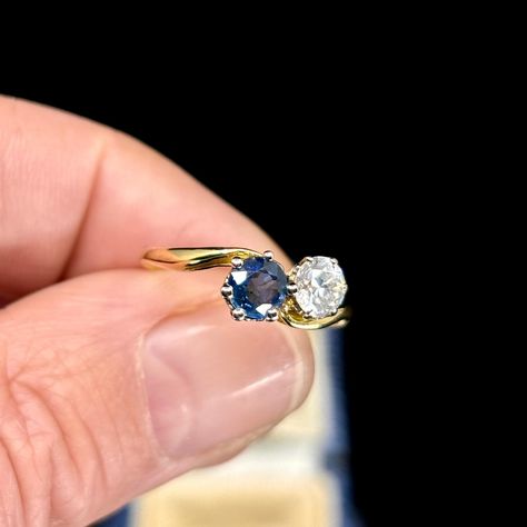 We love the ‘Toi et Moi’ rings, symbolising two individuals in a union. They come in different gemstones, this circa 1920’s ‘Toi et Moi’ ring is set with a Diamond and a Sapphire. Handmade, this ring is set with a 0.50ct Old European Cut Diamond and a round cut Sapphire, claw set in platinum on a semi cross over shoulder with a fine band in 18K yellow gold. This ring is a traditional engagement ring, a design which has been used since the 18th century, but it can also be bought as an enga... Toi Et Moi Ring Sapphire Diamond, Moi Et Toi Engagement Ring Sapphire, Sapphire Toi Et Moi Ring, Traditional Engagement Ring, 1920s Engagement Ring, Traditional Engagement, Traditional Engagement Rings, Ring Sapphire, Jewelry Tattoo