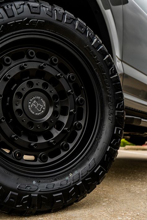 This 2020 Ford F150 XLT took a dip in our paint department to receive a matching set of painted lead foot mirror caps, grille inserts, and magnetic metallic badges. We fitted it with a 2-inch lift kit, 20-inch Black Rhino Arsenal wheels, and Nitto Ridge Grappler tires. We finished it off with a spray-in bed liner and UltraFlex Tonneau Cover, making this build a match made in heaven for any F150 enthusiast. Black Ford F150, Truck Rims And Tires, 2020 Ford F150, F150 Accessories, Ford F150 Lariat, Black Rhino Wheels, Nitto Ridge Grappler, Truck Life, Bronze Wheels