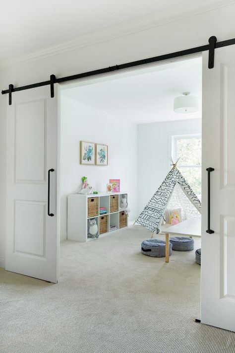 Flex room playroom with barn doors. The landing area opens to a flex room, currently used as a playroom. Bria Hammel Interiors Flex Room Ideas, Modern Kids Playroom, Farmhouse Playroom, Diy Playroom, Barn Style Sliding Doors, Interior Design Minimalist, Interior Sliding Barn Doors, Playroom Design, Flex Room