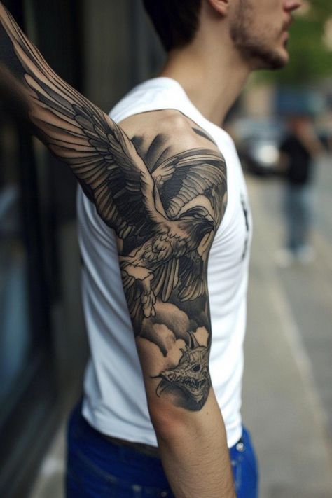 Man with a detailed black and grey eagle tattoo on his upper arm. Top Arm Tattoo For Men, Top Arm Tattoo, Man Arm, Arm Tattoos For Men, Compass Rose Tattoo, Celtic Knot Tattoo, Lighthouse Tattoo, Knot Tattoo, Map Tattoos