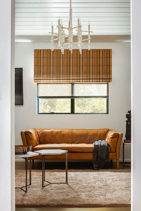 The horizontal lines of Aventura Roman Shades pair perfectly with vertical stripes, like @sunbrella Modo in Lakeside. | The Shade Store Roman Shades Living Room, Modern Roman Shades, Fabric Window Treatments, The Shade Store, Double Window, Custom Roman Shades, Woven Wood Shades, Shade Store, Roman Shade