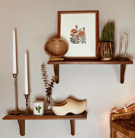 Mid Century Modern Shelf Styling, Layered Pictures On Shelf, Boho Floating Shelf Decor Living Room, Mcm Shelf Decor, Mid Century Floating Shelves, Thrifted Shelf Decor, Style Floating Shelves Living Room, Plant Shelf Above Tv, Boho Floating Shelf Decor