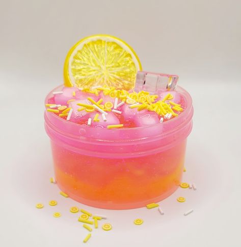 Iced Lemonade Jelly Cube Slime Texture: Jelly Cube/Clear Slime Color: Pink with a hint of Yellow ( Please keep in mind, the two colors may mix during shipping Process) Scent: Lemonade ( lightly scented ) ASMR: stretching, poking, squishing, and bubble pops Add Ins: Lemon Slice Charm, Ice Cube Charm, White, yellow and Lemon Fimo and Sprinkle Packets Level: Intermediate/Expert  (Please message us if you have questions regarding the levels of slime :) ) Note: Due to scent added to clear slime, slime will not be crystal clear.  **For all Clear Glue Based Slimes/Clear/Snowfizz/Bingsu slimes, we activate perfectly for shipping purposes. When slime arrives, please always finger test in case slime arrives sticky - then add activator as desired if needed **The following will be included based on pa Slime Inspiration, Lemonade Jelly, Jelly Cube Slime, Iced Lemonade, Slime Texture, Slime Aesthetic, Kids Christmas List, Pink Slime, Jelly Slime