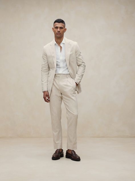 Designed with warm climates in mind, this sleek white suit pant is cut from an herringbone fabric that blends together soft cotton and luxurious linen.  Tailored Slim Fit: Mid-rise.  Tapered slim leg.  Zip fly with button-tab waistband.  Belt loops and after-dinner split detail at back.  Front and back pockets.  Half lined (lined to the knee).  Tailored Slim Fit: Mid-rise.  Tapered slim leg.  Inseams: Short 29. 5", Regular 31. 5", Long 33. 5" Model: Size 32 Regular, 6'2" (188cm). White Linen Suits For Men, Linen Men Outfit, Men Loafers Outfit, Linen Outfit Men, White Linen Outfit, Casual Groom Attire, Suit For Men Wedding, Linen Suits For Men, Linen Pants Suit