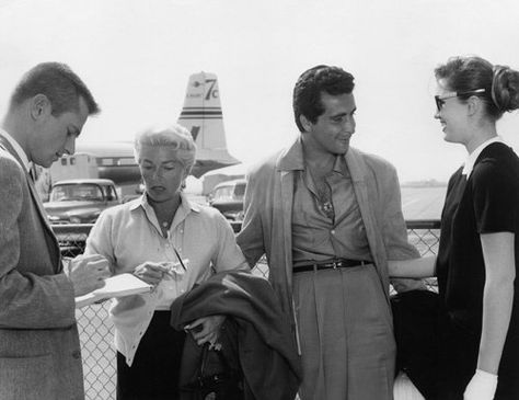 Cheryl Crane chats with smiling Johnny Stompanato and her mother, Lana Turner, when they returned to Los Angeles from a vacation in Acapulco, Mexico.  An unidentified reporter interviewed the star. 04-05-1958 Cheryl Crane, Johnny Stompanato, Mickey Cohen, Famous Murders, Susan Hayward, Lana Turner, Metro Goldwyn Mayer, Bette Davis, Will Turner