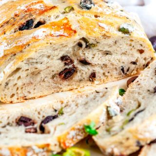 No Knead Olive Bread - A crusty, artisan easy to make greek olive bread with garlic and oregano. No kneading required! From aberdeenskitchen.com #noknead #artisan #olive #bread #dutchoven #greek #oregano #garlic #baking No Knead Olive Bread, Bread With Garlic, Greek Bread, Cheddar Bread, Olive Bread, Italian Olives, Artisan Bread Recipes, Greek Olives, Knead Bread