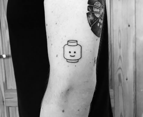 Lego Movie Tattoo, Lego Figure Tattoo, Lego Head Tattoo, Lego Tattoo Ideas, Regular Show Tattoo, Lego Tattoo, Smiley Face Tattoo, Minimal Tattoo Ideas, Around Arm Tattoo