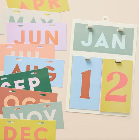 Easily change out the date and month display with bold, minimalist month and date cards. This hanging wall calendar is a colorful and unique gift for students, teachers, and coworkers that can be used year after year. Mount the metal calendar to your wall or prop it up on your desk for a fun way to stay up to date.-7.25" x 10.75" Metal Framed Perpetual Calendar-12 PVC Cards with Months of the Year-14 PVC Cards for Days of the Month-Packaged in Clear Tray Box for Gifting Calender Packaging, Wall Calender, Ikea Home Office, Fair Crafts, Inspiring Illustration, Posters On Wall Bedroom, Calendar Poster, Gift For Students, Ikea Home