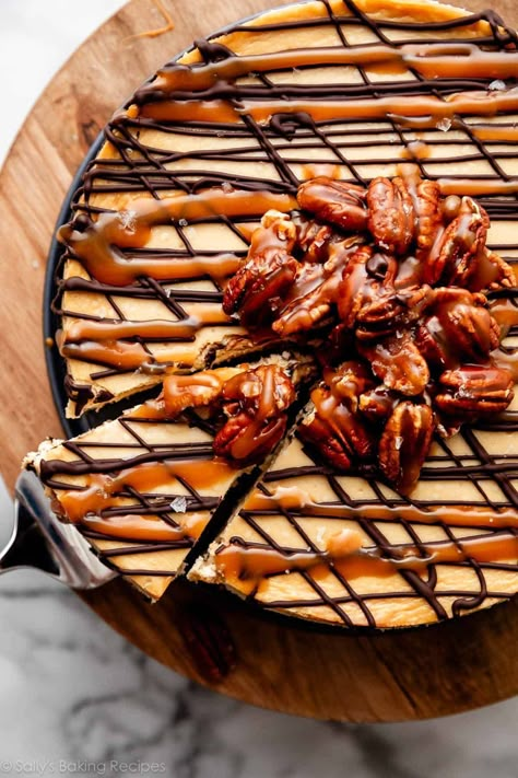 This caramel turtle cheesecake takes the tasty trio that makes up turtle candies—caramel, pecans, and chocolate—and combines it with rich, creamy cheesecake. From the thick Oreo crumb crust to the smooth cheesecake layered with caramel sauce, this pecan-studded beauty is an indulgent dessert that elicits plenty of oohs and aahs from all who are lucky enough to try a slice! Recipe on sallysbakingaddiction.com Caramel Turtle Cheesecake, Cranberry Christmas Cake, Turtle Cheesecake Recipes, Cranberry Christmas, Cranberry Cake, Turtle Cheesecake, Pecan Cheesecake, Sally's Baking, Homemade Caramel Sauce