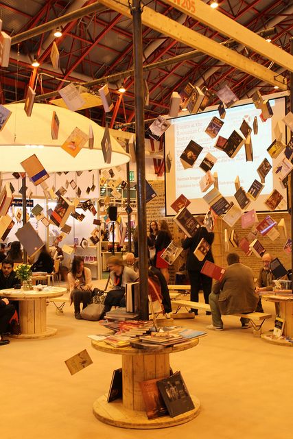 Fun picture! Books Hanging From Ceiling, Book Fair Ideas Display, Bookshop Café, Bookstore Design, Library Cafe, Stand Feria, Bookstore Cafe, Book Festival, Book Cafe