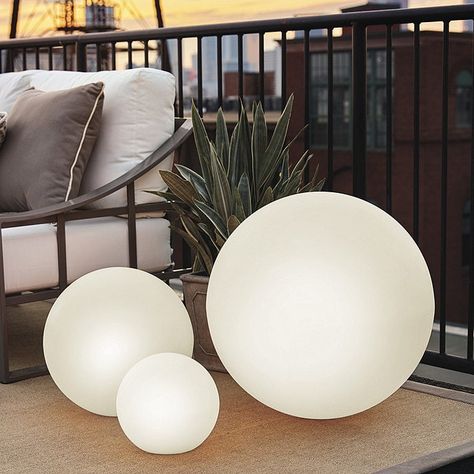 If your backyard oasis includes a deck, then you’ll need some deck lighting ideas to help you continue to enjoy your space once the sun goes down. If ... | Glowing Spheres #DeckLighting #Deck #Lighting #DeckLightingIdeas #DecoratedLife Garden Balls, Outdoor Space Design, Waterproof Led Lights, Floating Lights, Ball Lamps, Ball Lights, Outdoor Solar Lights, Ballard Designs, Outdoor Solar