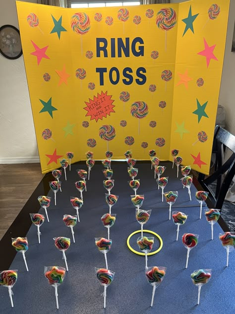 Easy Fun Fair Games, Sucker Ring Toss Game, Carnival Games Christmas, Carnival Game Ideas For Kids, Old School Carnival Games, Office Carnival Party Ideas, Candyland Themed Games, Lollipop Ring Toss, Carnival Games Birthday Party