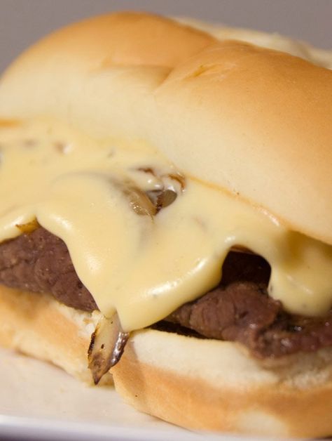 Sauteed steak and onions piled high on a hoagie roll and topped with cheese sauce. It doesn’t get much better. Philly Cheese Steak Sauce, Denver Sandwich, Cheese Sauce For Steak, Philly Cheese Steak Sandwich Recipe, Philly Cheesesteak Sandwiches, Best Philly Cheesesteak, Philly Sandwich, Cheesesteak Sandwiches, Sauteed Steak