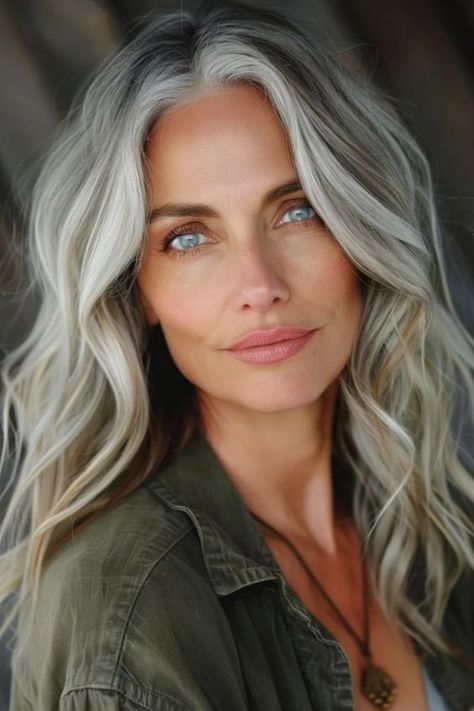 Gray hair blending is all the rage right now, and it’s easy to see why. It’s a fun, stylish way to rock your natural grays without fully committing to a head of silver. Whether you’re Ice Blonde Grey Hair, Blond With Grey Highlights, Grey Highlights In Blonde Hair, Best Way To Blend Gray Hair, Blending Gray Hair With Blonde Highlights, Gray Hair Blonde Highlights, Gray Hair With Green Eyes, Blending Greys Into Blonde Hair, Blonde Going Gray